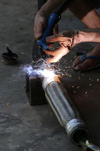 Man working on metal in factory