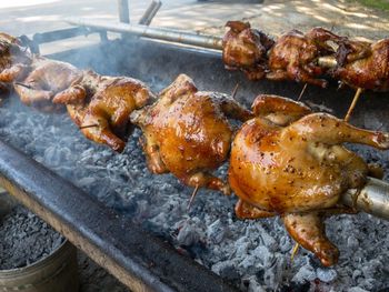 High angle view of meat on barbecue grill