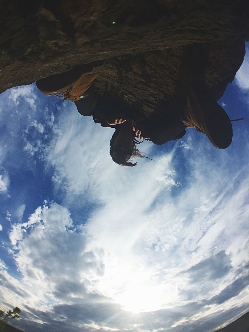 low angle view, mid-air, sky, one person, day, real people, cloud - sky, leisure activity, adventure, men, jumping, outdoors, extreme sports, full length, nature, energetic, fish-eye lens, people