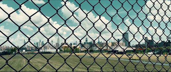 Full frame shot of chainlink fence against sky