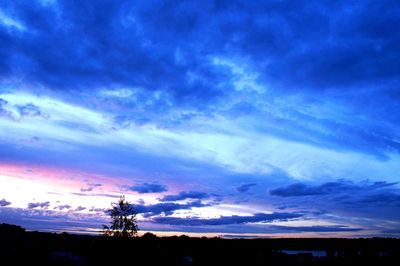 Scenic view of dramatic sky over landscape