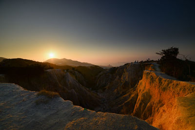 Scenic view of mountains against sky during sunset