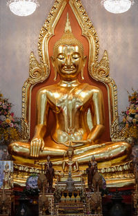 Buddha statue in temple outside building