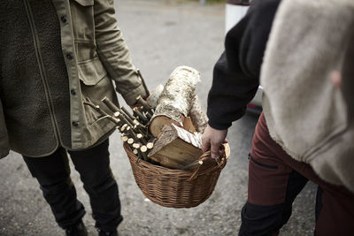 Midsection of man working in basket