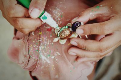 Midsection of woman holding craft product