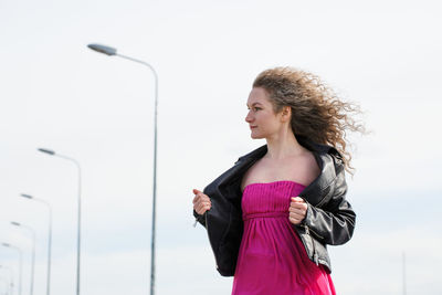 Woman against the background of the sky and lanterns