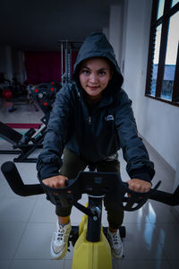 Portrait of boy standing on floor