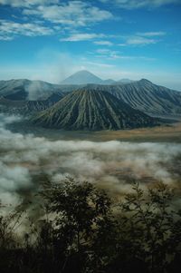 View of volcanic landscape against cloudy sky