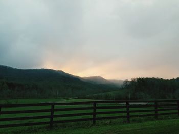 Scenic view of field against sky during sunset