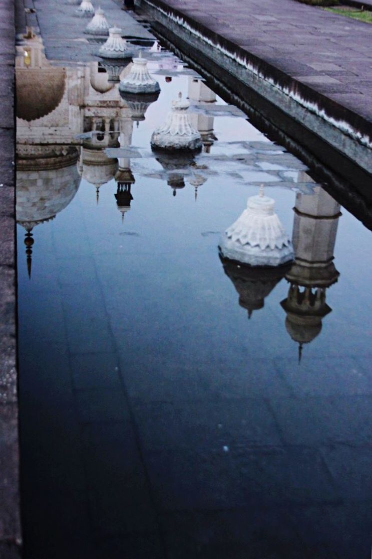 REFLECTION OF CATHEDRAL IN PUDDLE