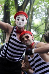 Portrait of young couple with red sunglasses