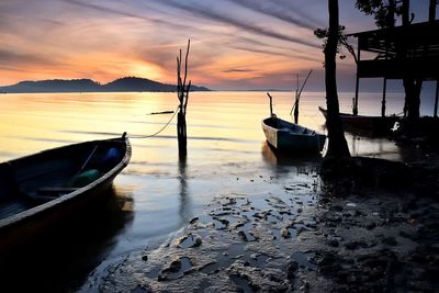 Boats moored at harbor