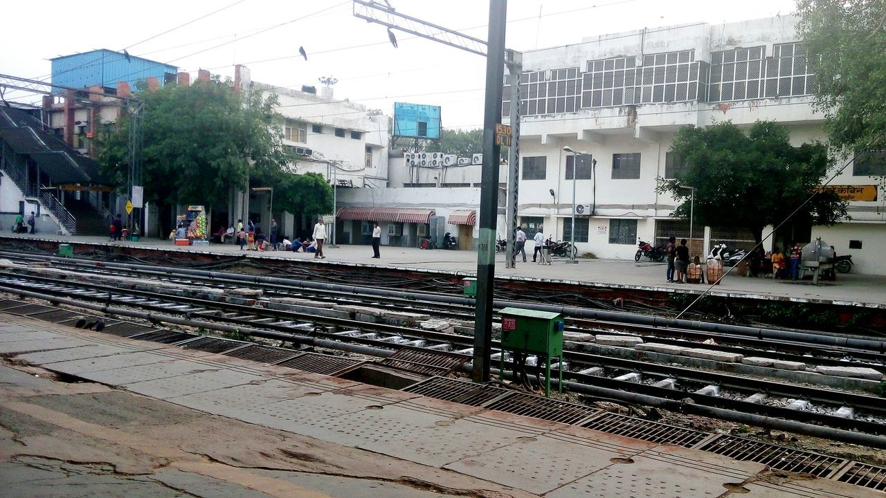 RAILROAD TRACKS ON RAILROAD STATION PLATFORM