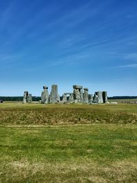 Stonehenge against sky during sunny day