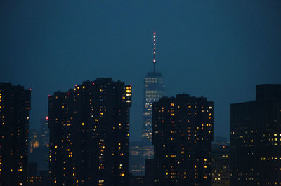 Illuminated buildings in city at night