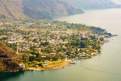 High angle view of townscape by sea