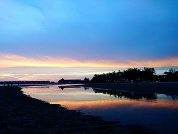 Scenic view of lake against sky during sunset