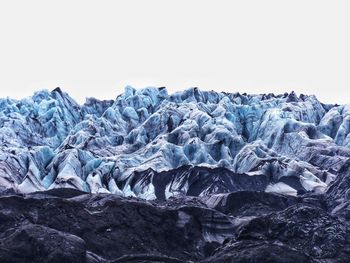 Scenic view of frozen landscape against sky