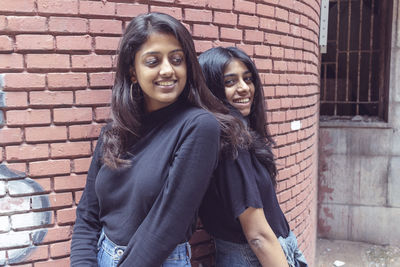 Friends forever. two cute lovely girl friends posing with smile