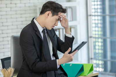 Young man using mobile phone