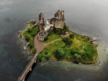 High angle view of old castle on shore