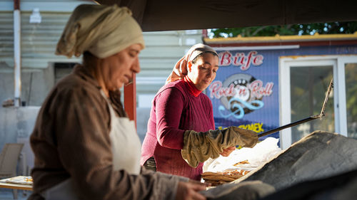 Traditional turkish bread baking in a tandoor. ramadan traditions and atmosphere. food in ramadan