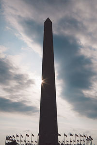 Low angle view of monument against cloudy sky