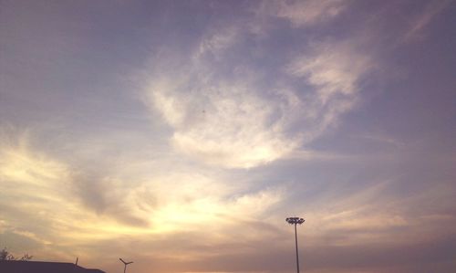 Low angle view of silhouette street light against sky