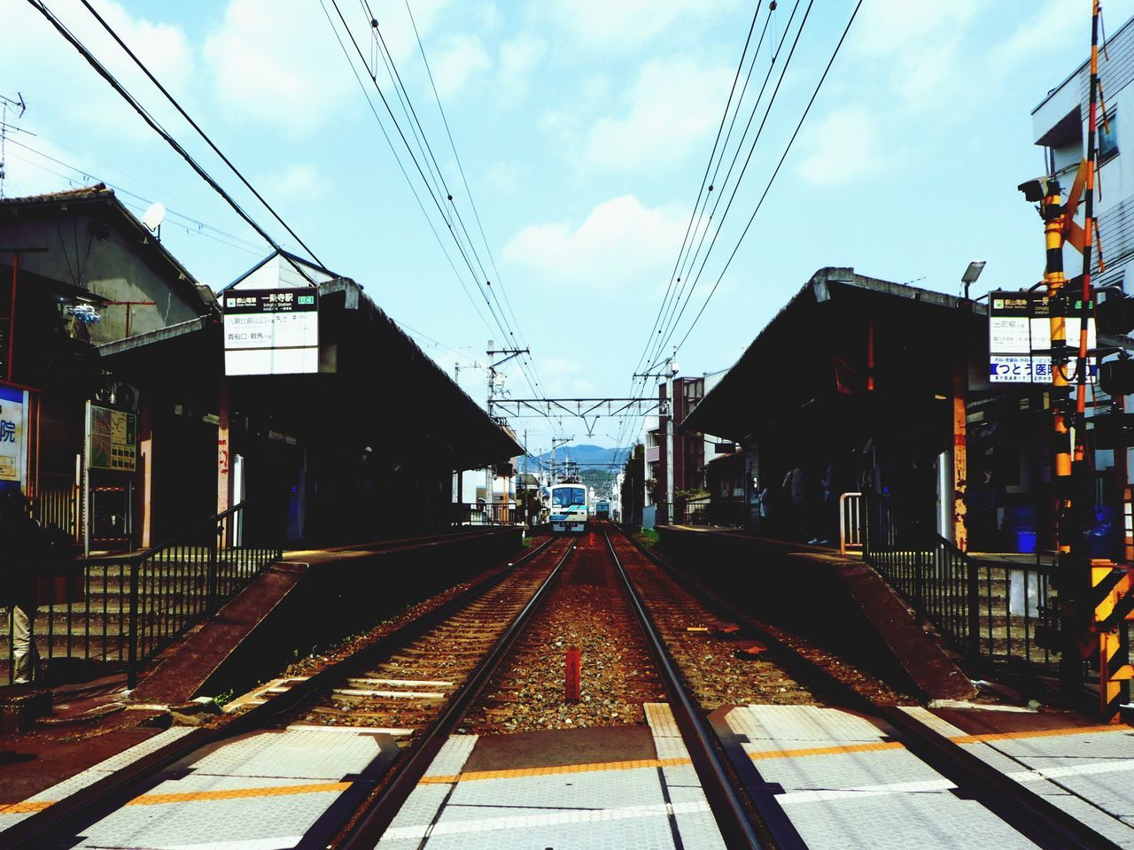 RAILWAY TRACKS AGAINST SKY