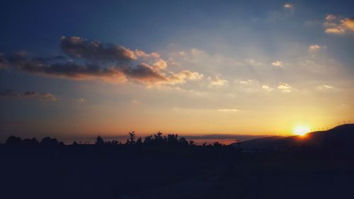 Scenic view of silhouette landscape against sky during sunset