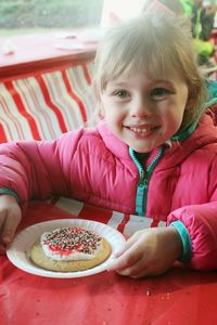 Portrait of girl with cookie