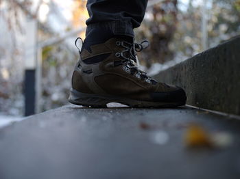 Low section of man standing on steps