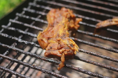 High angle view of meat on barbecue grill