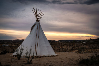 Close-up of tent on land against sky