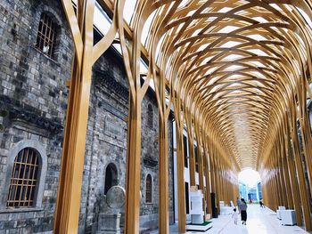 Covered walkway by buildings in city