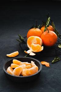 Close-up of orange fruits in plate