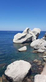 Scenic view of sea against clear blue sky