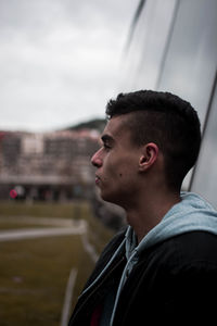 Portrait of young man looking away