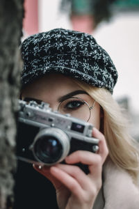 Portrait of woman photographing