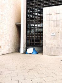 Empty footpath against building