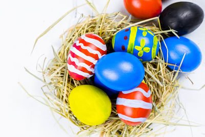 High angle view of multi colored eggs in basket