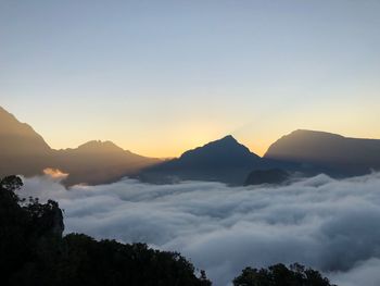 Scenic view of silhouette mountains against sky during sunset