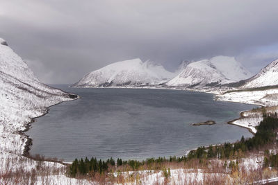 Scenic view of snowcapped mountains and lake against sky