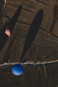 Aerial view of hot air balloon by road