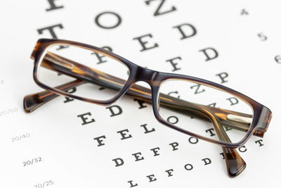 Close-up of eyeglasses on paper