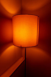 Close-up of illuminated lamp on table at home