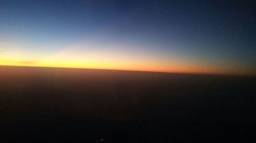 Scenic view of landscape against sky at sunset