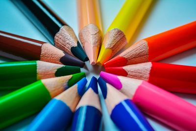 Close-up of colorful pencils on table