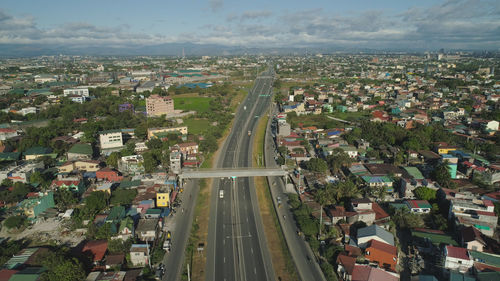 Aerial view of highway with road junction, car and traffic in manila, philippines. 