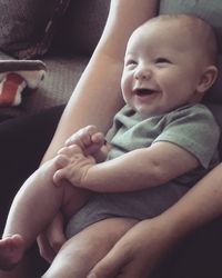 Cute baby girl sitting at home
